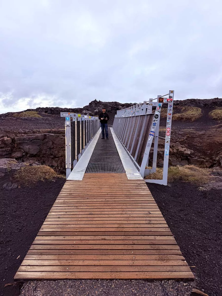 Person standing on the Bridge Between Continents in Iceland