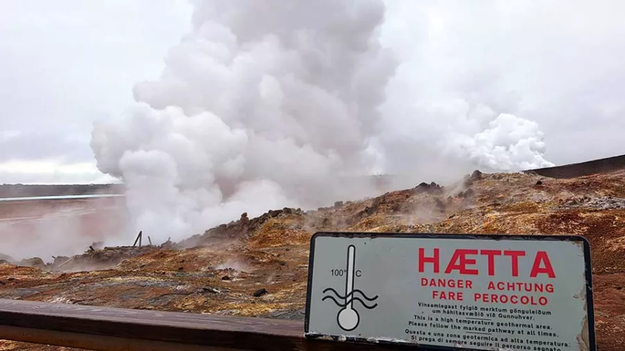 Warning sign in front of steam vents at Gunnuhver geothermal area